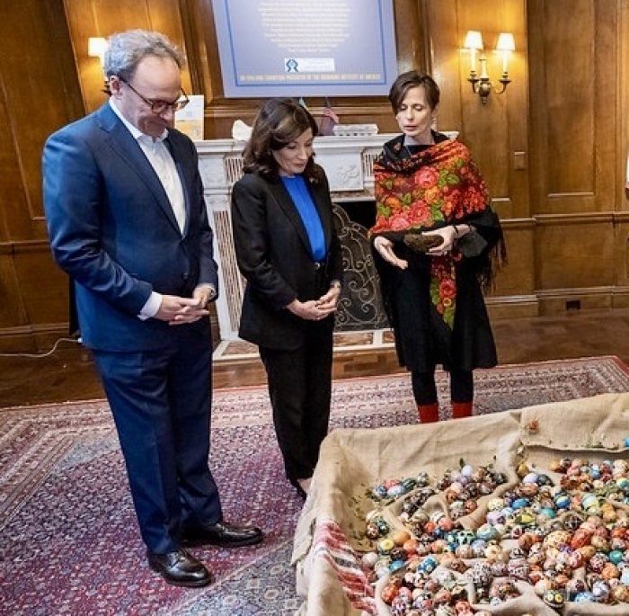 New York State Governor Kathy Hochul and Mr. William Hocul learn about the power of the installation
