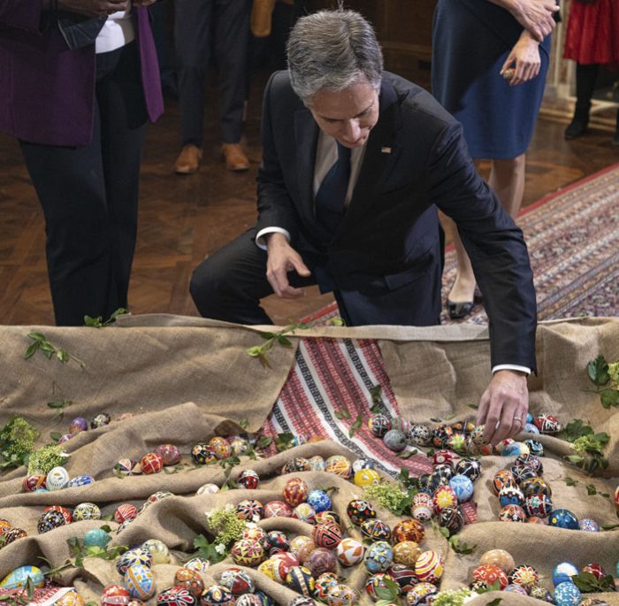 Secretary of State Antony Blinken placing a pysanka in the installation